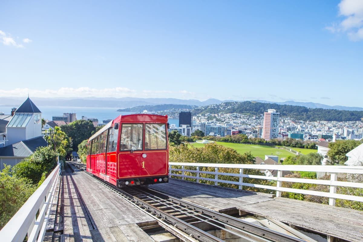 A Wellington icon since 1902 — NZ's only remaining funicular railway. The five-minute ride climbs 120 metres from Lambton Quay through three tunnels and over three bridges to Kelburn. At the top: panoramic harbour views, the Botanic Garden, Carter Observatory, the Cable Car Museum, and a free shuttle to Zealandia. Originally steam-powered, now electric, and still the best way to get a feel for this city. Walk down through the garden afterwards — trust us.